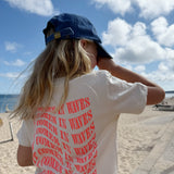 'It Comes in Waves' kids T-shirt Summery Soft Orange